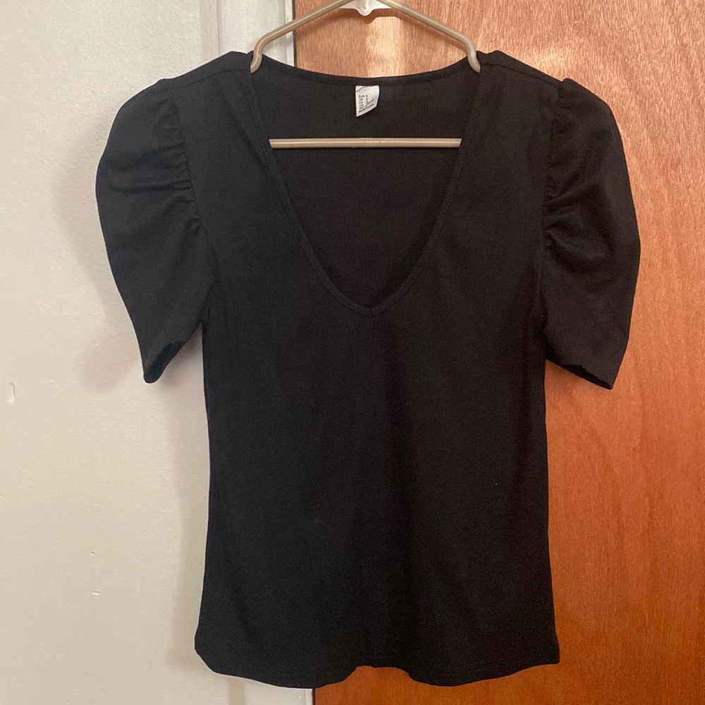 Black blouse with puff sleeves.